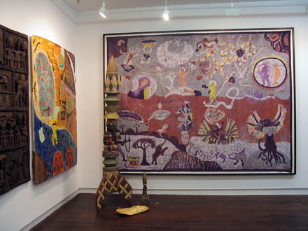 African_Astronauts Picture of installation of paintings and sculpture depicting space themes merging contemporary and traditional Burkina Faso art styles