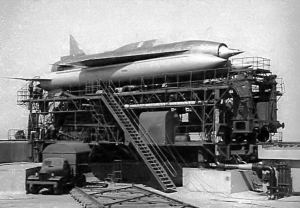 Archive black and white photo of a rocket on a launch scaffolding