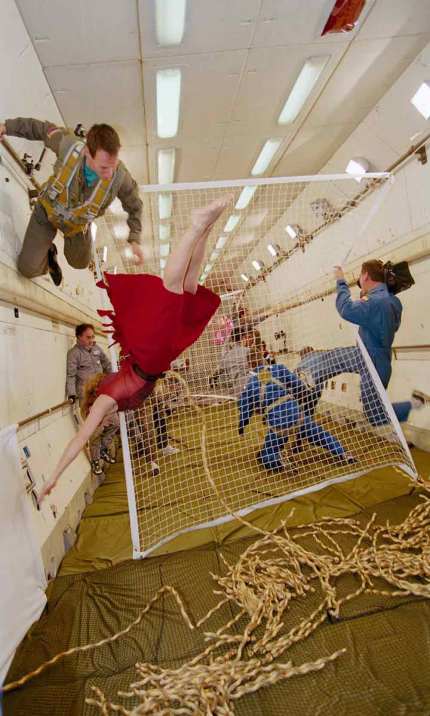 Gravity_ALoveStory A dancer in a red dress on a Russian parabolic (zero gravity) flight