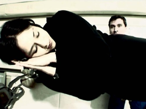 wpid-1296599846image_web1 A woman floats, apparently asleep, in mid air